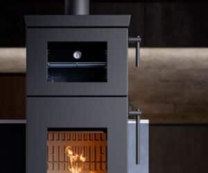 Modern stove with a focus on details: visible door handles, thermometer and blazing fire in a dark gray housing.