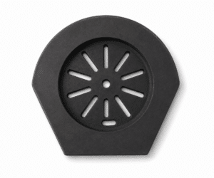 A black, hexagonal cast-iron part with rounded edges and radial slits in the center. Suitable as an accessory for wood-burning stoves.
